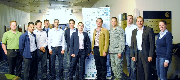 Young AFCEANs from the Bonn and Kaiserslautern chapters visit the Ramstein TechExpo in July as part of the first joint event, organized by Jochen Reinhardt (5th from r), chapter Young AFCEAN representative, and Master Sgt. Douglas Brock, USAF (4th from r), Kaiserslautern Chapter. 